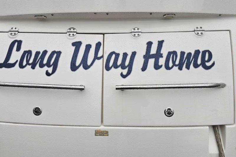  Yacht Photos Pics 2007 Sea Ray 60 Sundancer yacht with "Long Way Home" lettering on the stern.