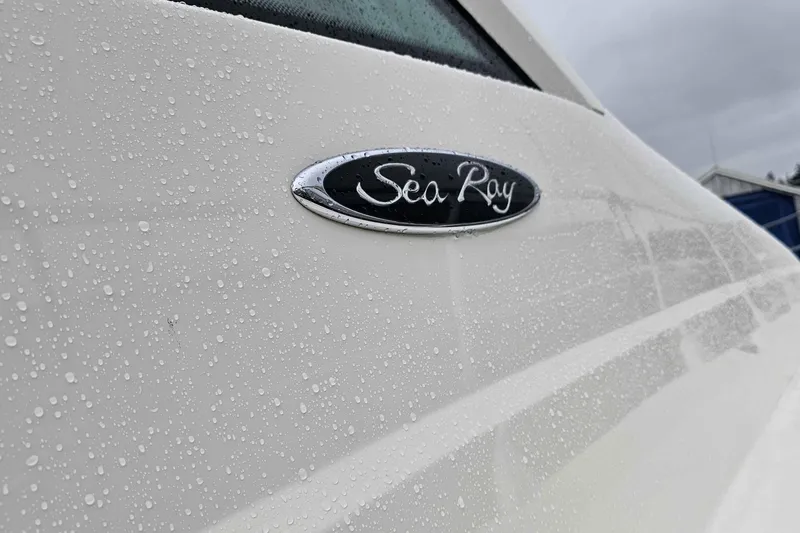  Yacht Photos Pics 2007 Sea Ray 60 Sundancer yacht with raindrops on its sleek white surface.