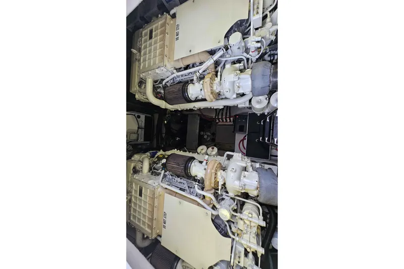  Yacht Photos Pics Engine room of 2007 Sea Ray 60 Sundancer yacht, showcasing dual engines and mechanical components.