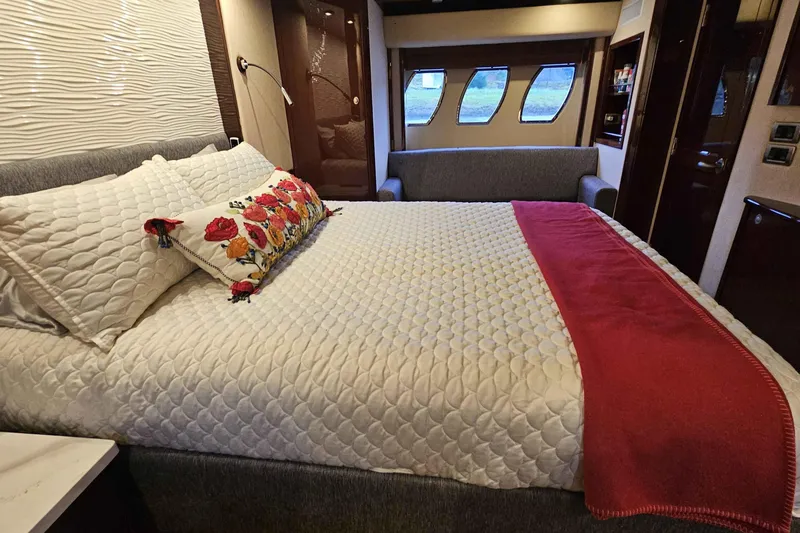  Yacht Photos Pics Luxurious bedroom interior of 2007 Sea Ray 60 Sundancer yacht with elegant bedding.