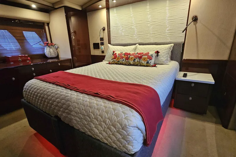  Yacht Photos Pics Luxurious bedroom interior of 2007 Sea Ray 60 Sundancer yacht with elegant bedding.