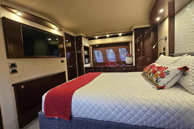  Yacht Photos Pics Luxurious bedroom interior of 2007 Sea Ray 60 Sundancer yacht with elegant decor.