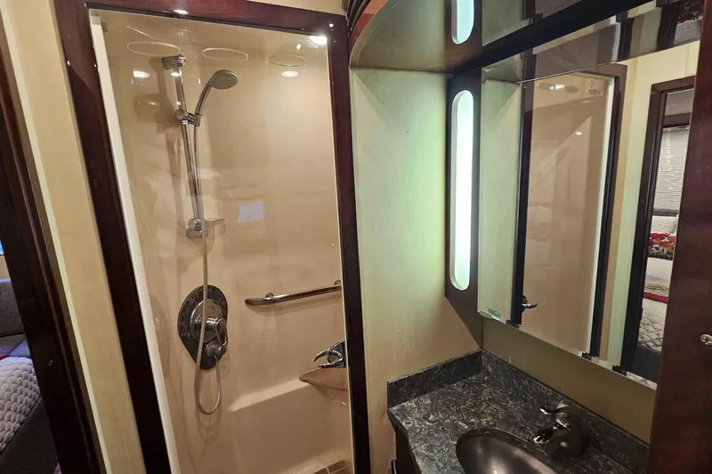  Yacht Photos Pics Luxurious bathroom in 2007 Sea Ray 60 Sundancer yacht with modern shower and vanity.