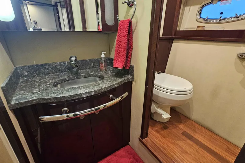  Yacht Photos Pics Luxurious bathroom in 2007 Sea Ray 60 Sundancer yacht with granite countertop and wooden flooring.