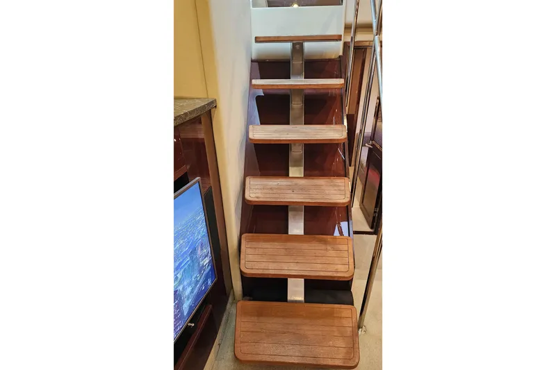  Yacht Photos Pics Wooden stairs inside 2007 Sea Ray 60 Sundancer yacht, featuring sleek design and modern finish.