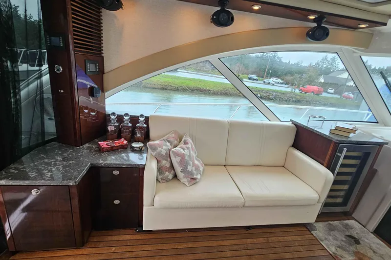  Yacht Photos Pics Luxurious interior of 2007 Sea Ray 60 Sundancer yacht with elegant seating and decor.