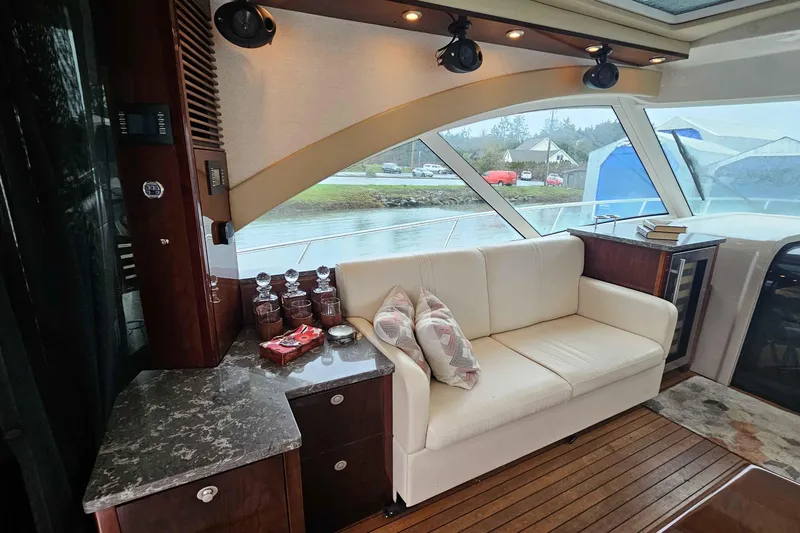  Yacht Photos Pics Luxurious interior of 2007 Sea Ray 60 Sundancer yacht with elegant seating and decor.