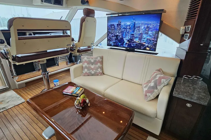  Yacht Photos Pics Luxurious interior of 2007 Sea Ray 60 Sundancer yacht with plush seating and modern amenities.