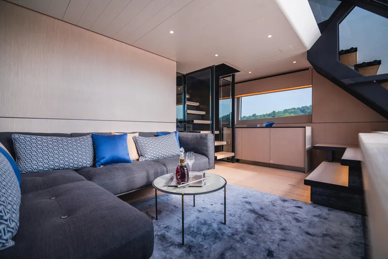  Yacht Photos Pics Luxurious interior of 2023 Bluegame BGX60 yacht with modern seating and elegant decor.