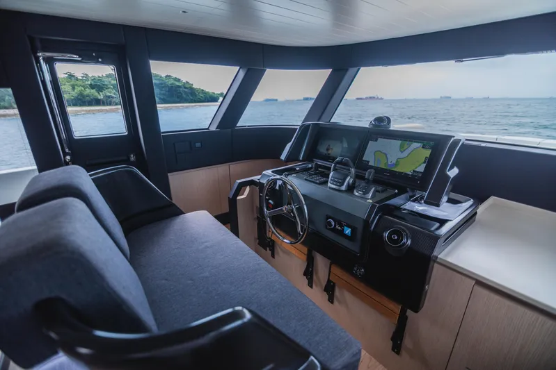  Yacht Photos Pics Interior of 2023 Bluegame BGX60 yacht with modern navigation system and ocean view.