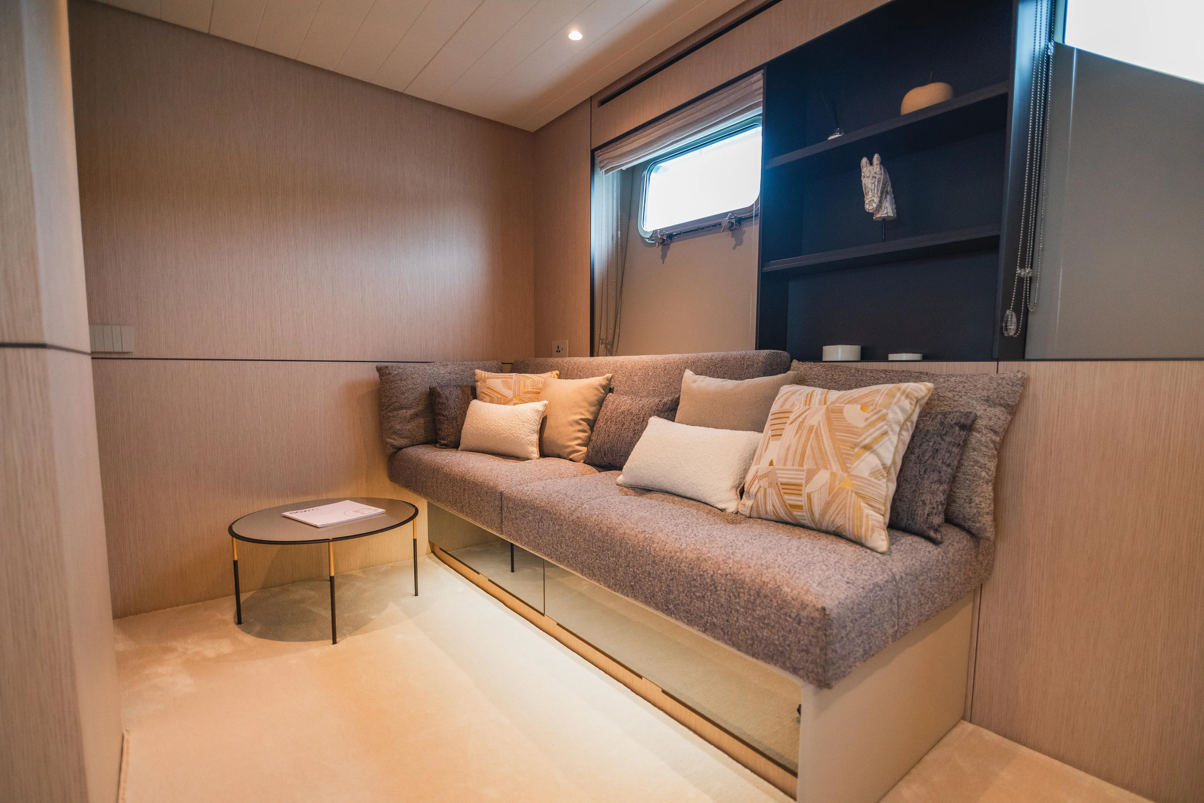  Yacht Photos Pics Luxurious interior of 2023 Bluegame BGX60 yacht with cozy seating and elegant decor.