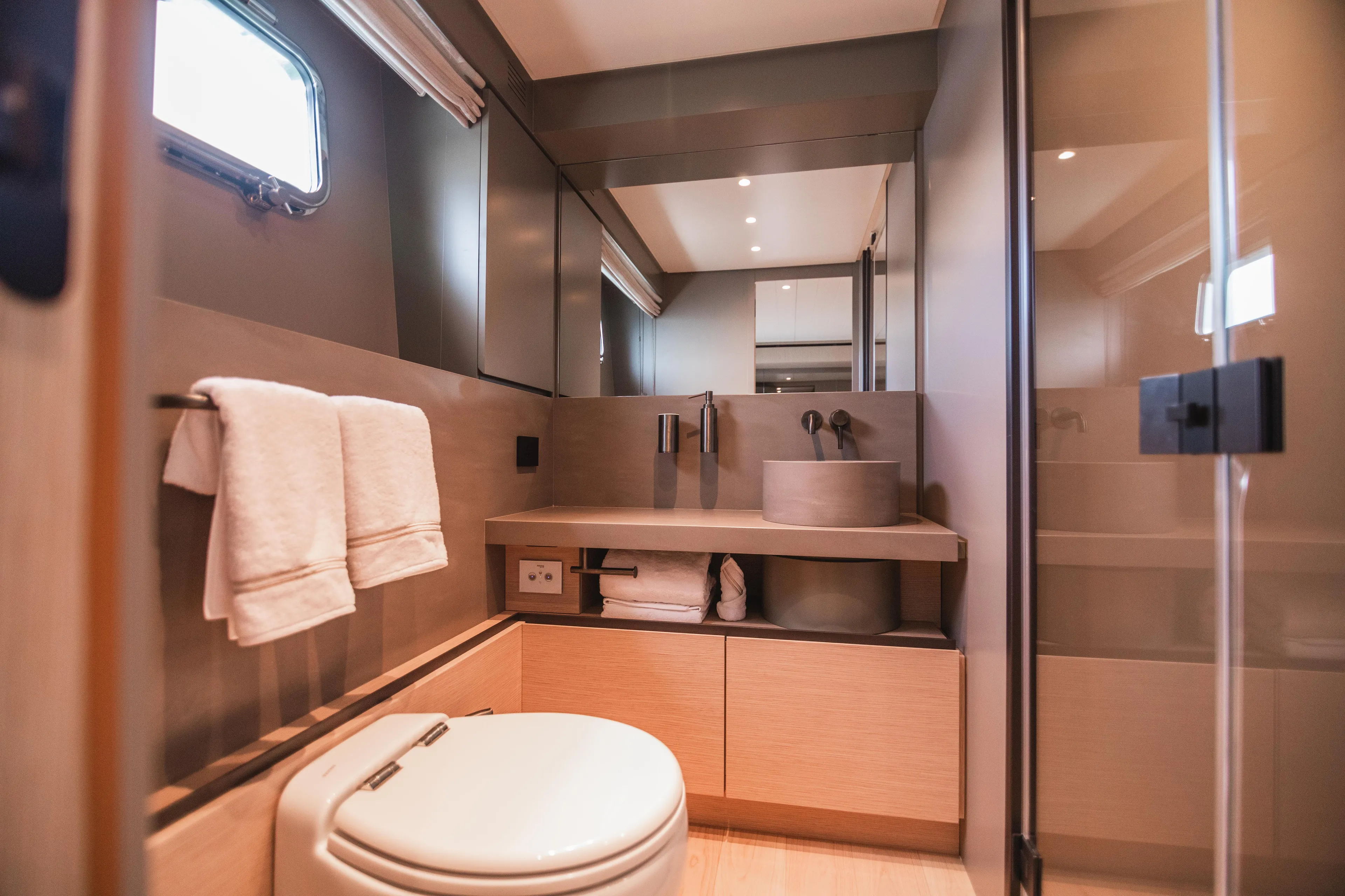  Yacht Photos Pics Modern bathroom interior of 2023 Bluegame BGX60 yacht, featuring sleek design and amenities.