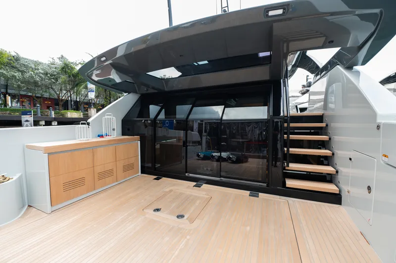  Yacht Photos Pics 2023 Bluegame BGX60 yacht deck with modern design and wooden flooring.
