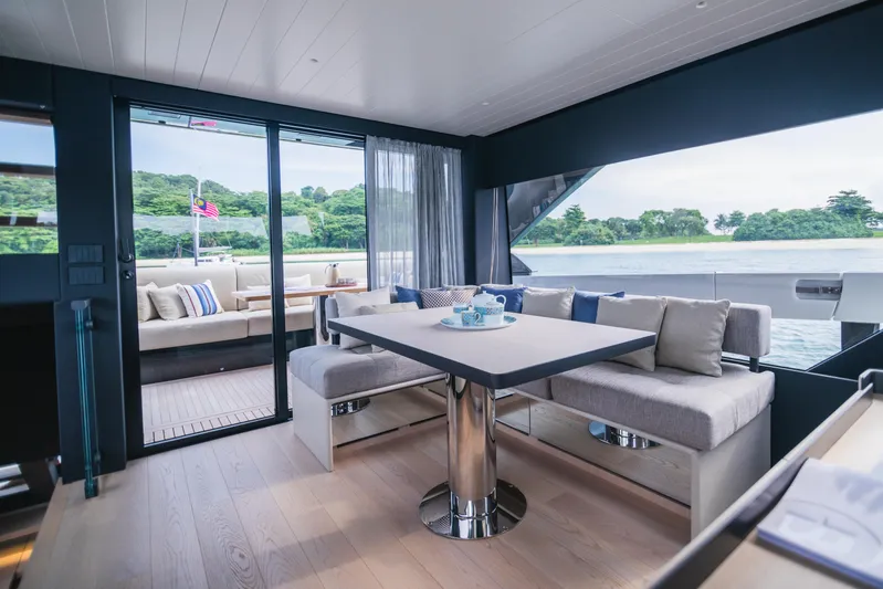  Yacht Photos Pics Luxurious interior of 2023 Bluegame BGX60 yacht with elegant seating and scenic views.