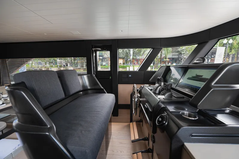  Yacht Photos Pics Interior of 2023 Bluegame BGX60 yacht with modern helm and seating area.