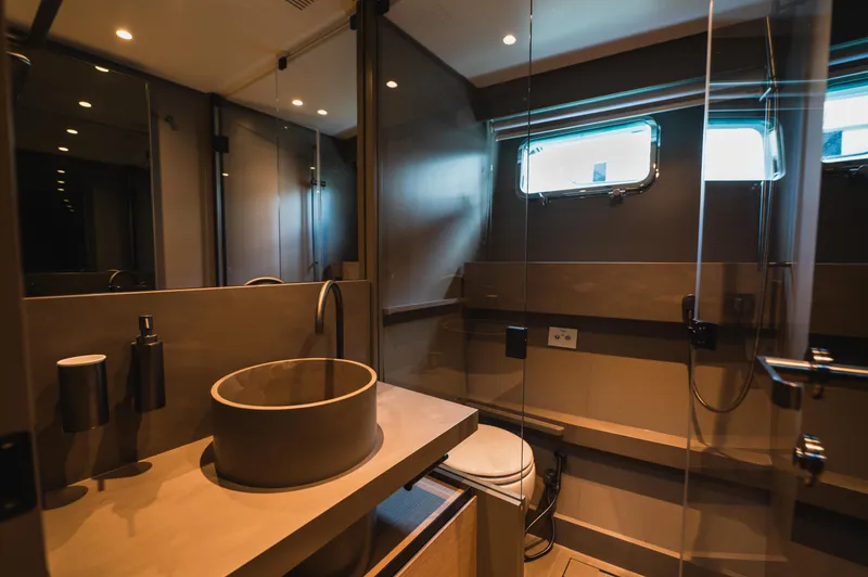  Yacht Photos Pics Luxurious bathroom interior of 2023 Bluegame BGX60 yacht with modern fixtures and lighting.