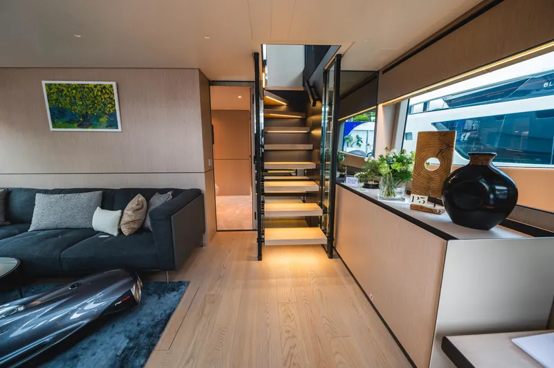  Yacht Photos Pics Luxurious interior of 2023 Bluegame BGX60 yacht with modern decor and elegant staircase.