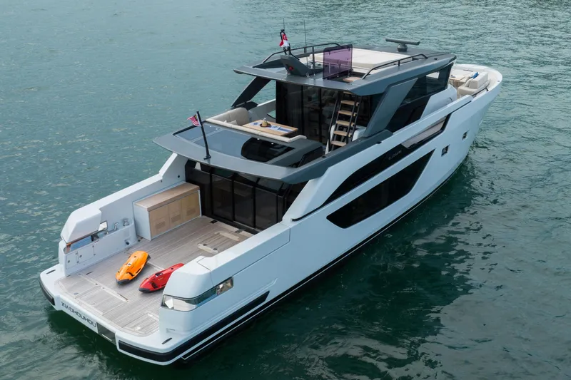  Yacht Photos Pics 2023 Bluegame BGX60 yacht on water, featuring sleek design and spacious deck.