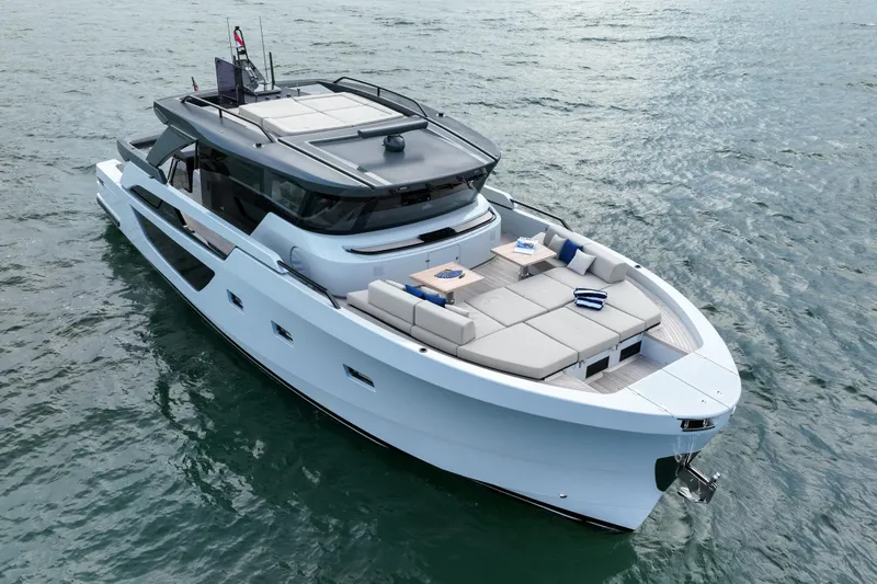  Yacht Photos Pics 2023 Bluegame BGX60 yacht on open water, featuring sleek design and spacious deck.