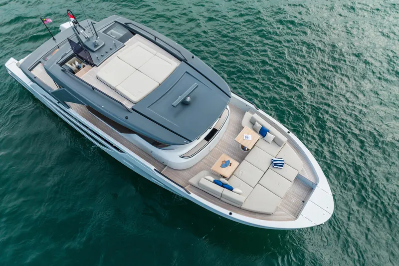  Yacht Photos Pics 2023 Bluegame BGX60 yacht on water, featuring spacious deck and modern design.