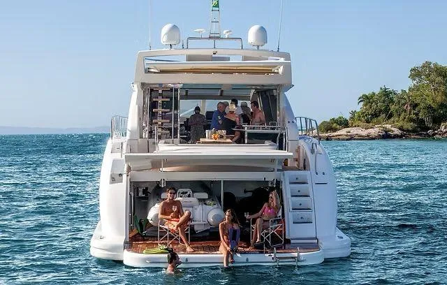  Yacht Photos Pics Luxury Schaefer 25M yacht, 2026 model, with people relaxing on deck in scenic ocean setting.