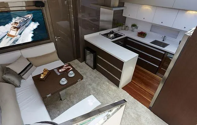  Yacht Photos Pics Luxurious interior of 2026 Schaefer 25M yacht with modern kitchen and cozy seating area.