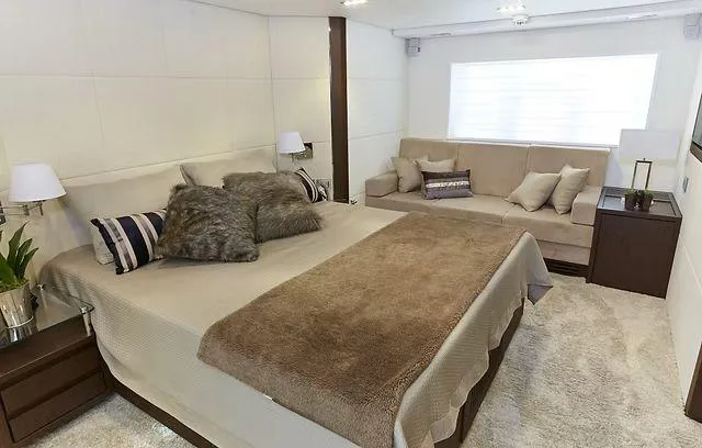  Yacht Photos Pics Luxurious bedroom in 2026 Schaefer 25M yacht with cozy bed and elegant decor.