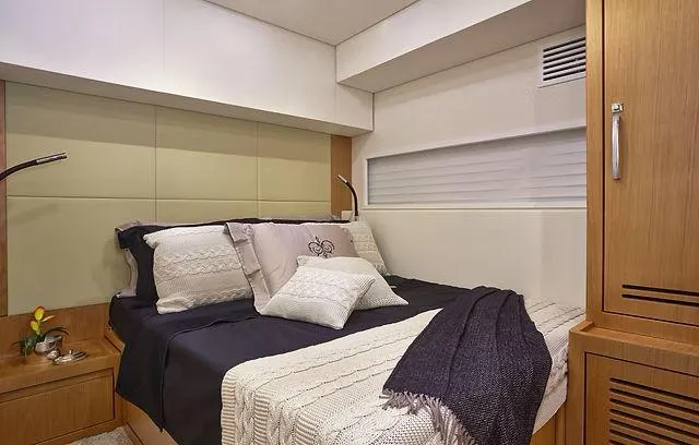  Yacht Photos Pics Luxurious cabin interior of 2026 Schaefer 25M yacht with cozy bedding and modern design.