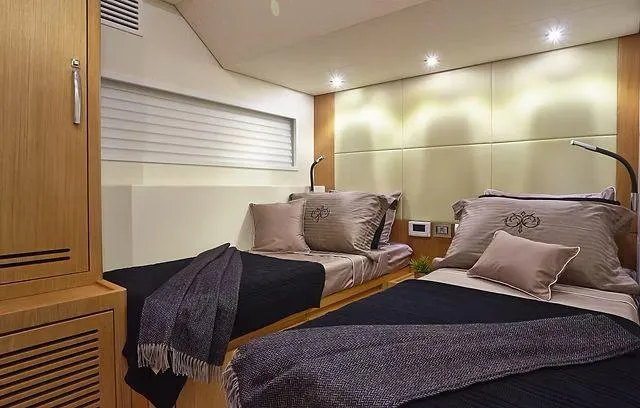  Yacht Photos Pics Luxurious cabin interior of 2026 Schaefer 25M yacht with twin beds and modern decor.