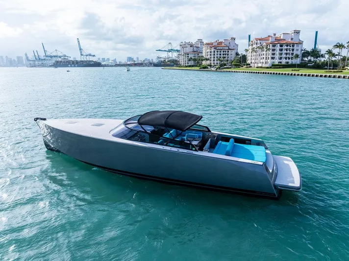 Daddy Yacht Photos Pics Luxury 2015 VanDutch 55 yacht on turquoise water near urban skyline.