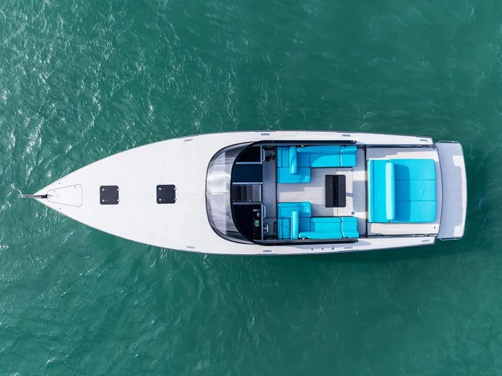Daddy Yacht Photos Pics Aerial view of 2015 VanDutch 55 yacht with turquoise seating on open water.