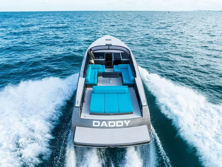 Daddy Yacht Photos Pics VanDutch 55 yacht cruising on open sea, 2015 model, with blue seating.