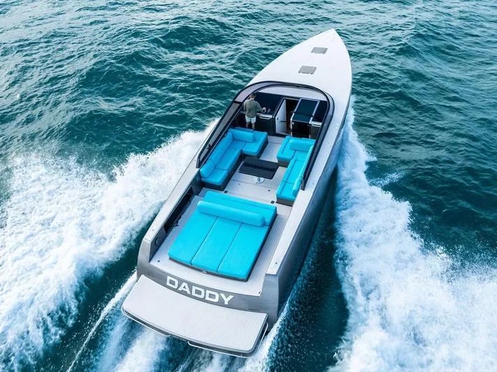 Daddy Yacht Photos Pics Luxurious 2015 VanDutch 55 yacht cruising on open water with sleek design and vibrant seating.