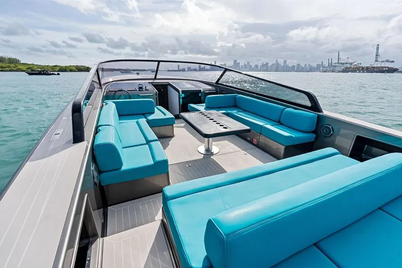 Daddy Yacht Photos Pics VanDutch 55 yacht, 2015 model, with turquoise seating, cruising on open water.