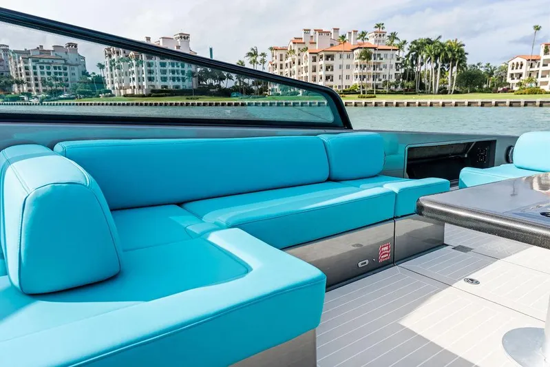 Daddy Yacht Photos Pics Luxurious 2015 VanDutch 55 yacht with turquoise seating, docked near waterfront buildings.