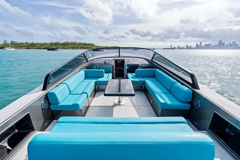 Daddy Yacht Photos Pics Luxurious 2015 VanDutch 55 yacht with turquoise seating, cruising on serene waters.