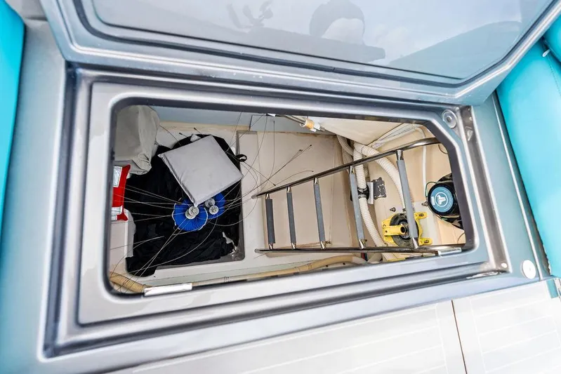 Daddy Yacht Photos Pics Interior storage compartment of a 2015 VanDutch 55 yacht, featuring a ladder and equipment.