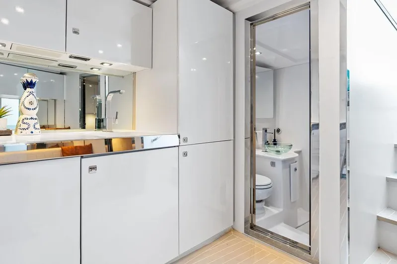 Daddy Yacht Photos Pics Luxurious interior of 2015 VanDutch 55 yacht featuring modern kitchen and bathroom.