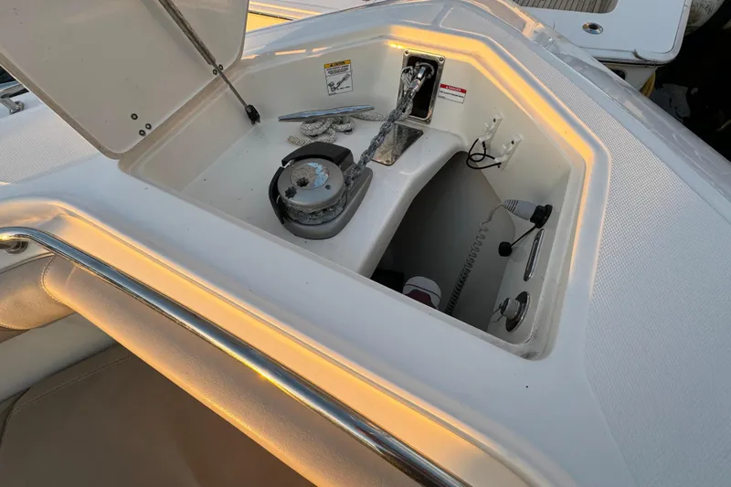  Yacht Photos Pics 2017 Boston Whaler 370 Outrage boat interior storage compartment with open hatch.