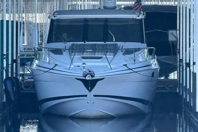  Yacht Photos Pics 2017 Regal 35 Sport Coupe docked in a marina, front view.