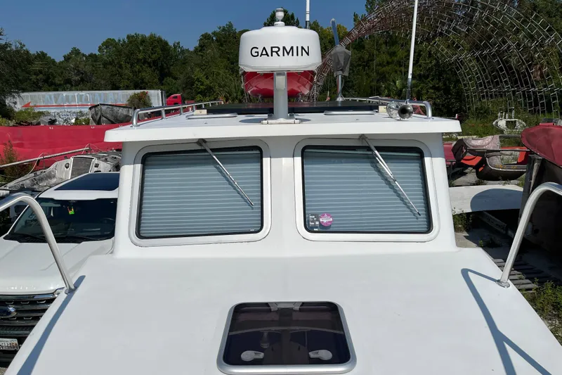 Lenore Yacht Photos Pics 2023 Great Harbour Trawlers TT35 boat with Garmin radar, docked outdoors.