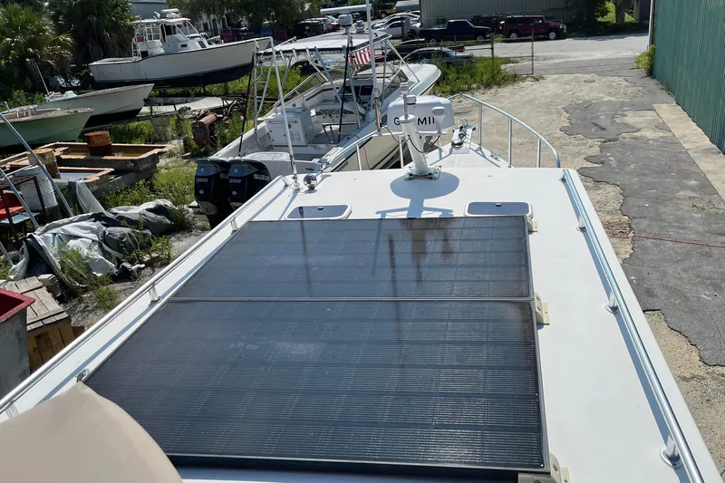 Lenore Yacht Photos Pics 2023 Great Harbour Trawlers TT35 with solar panels, docked in a boatyard.