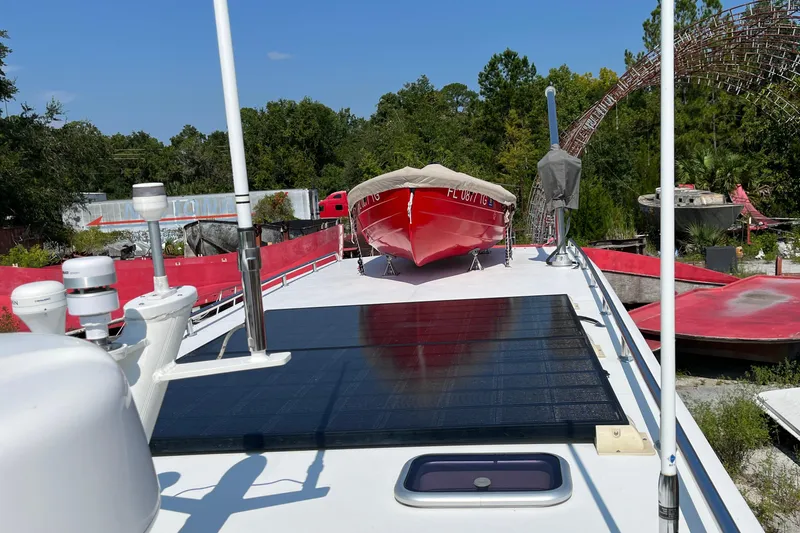 Lenore Yacht Photos Pics 2023 Great Harbour Trawlers TT35 with solar panels and red boat on deck.