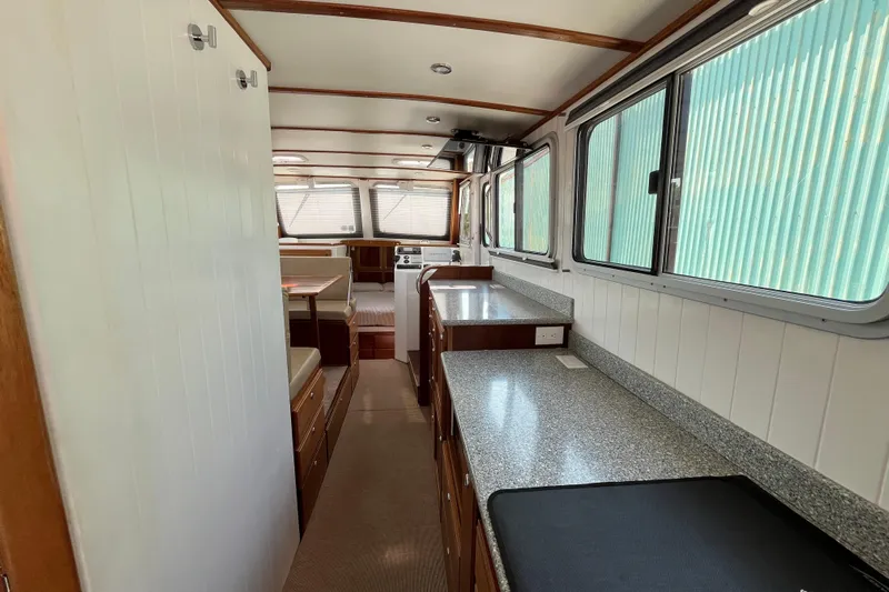 Lenore Yacht Photos Pics Interior of 2023 Great Harbour Trawlers TT35, featuring spacious kitchen and dining area.