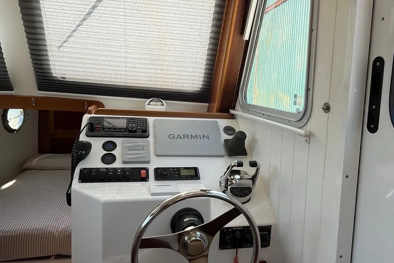 Lenore Yacht Photos Pics Helm of 2023 Great Harbour Trawlers TT35 with Garmin navigation system and controls.