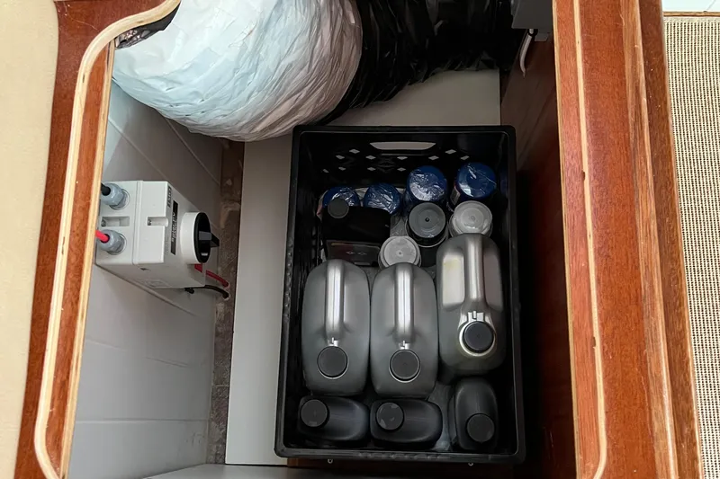 Lenore Yacht Photos Pics Storage compartment in 2023 Great Harbour TT35 with containers and electrical panel.