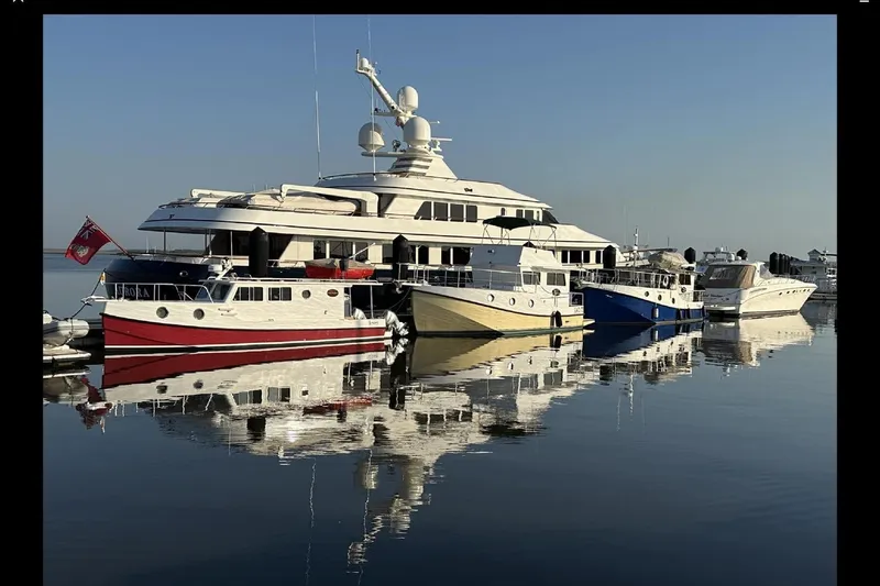 Lenore Yacht Photos Pics Boats docked at marina, featuring 2023 Great Harbour TT35 model, reflecting on calm water.
