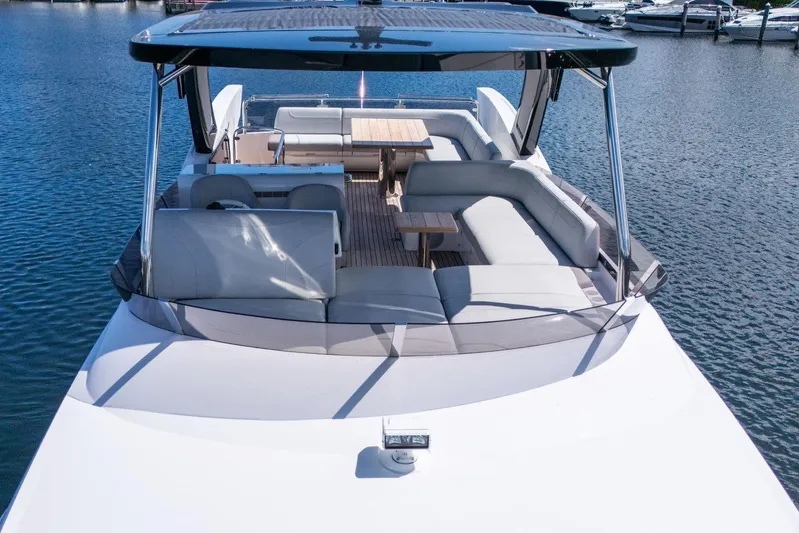  Yacht Photos Pics Luxurious 2023 Sunseeker Manhattan 68 yacht with spacious deck and seating area.