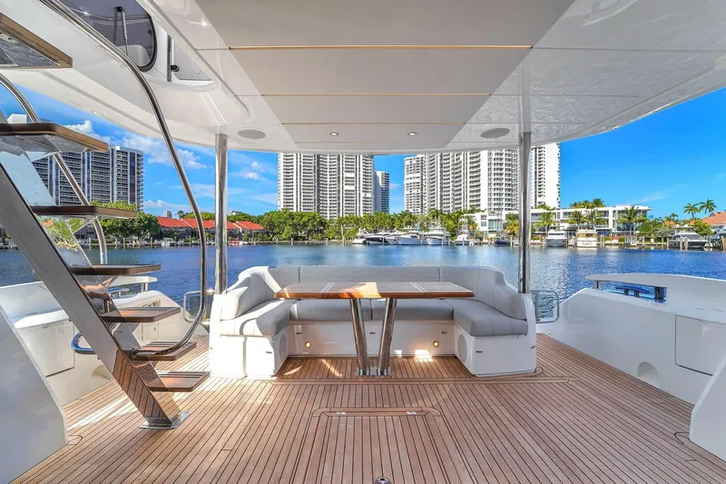  Yacht Photos Pics Luxurious 2023 Sunseeker Manhattan 68 yacht with elegant deck and waterfront view.