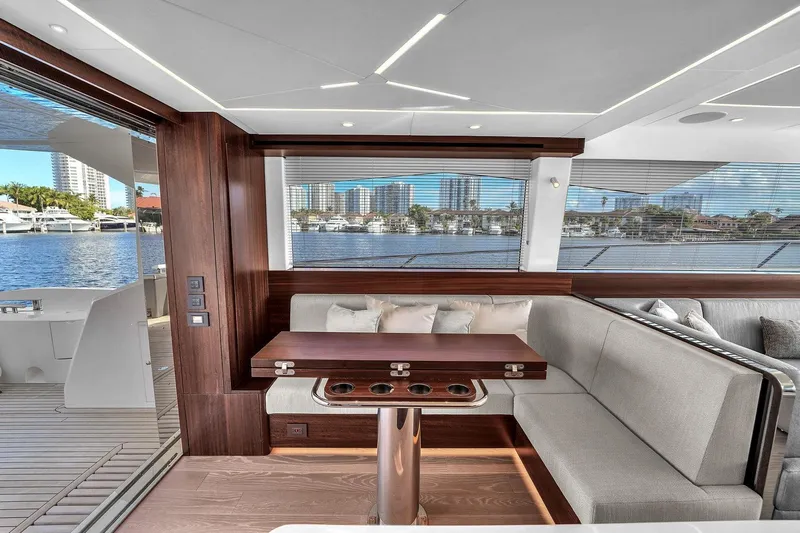  Yacht Photos Pics Luxurious interior of 2023 Sunseeker Manhattan 68 yacht with waterfront view.